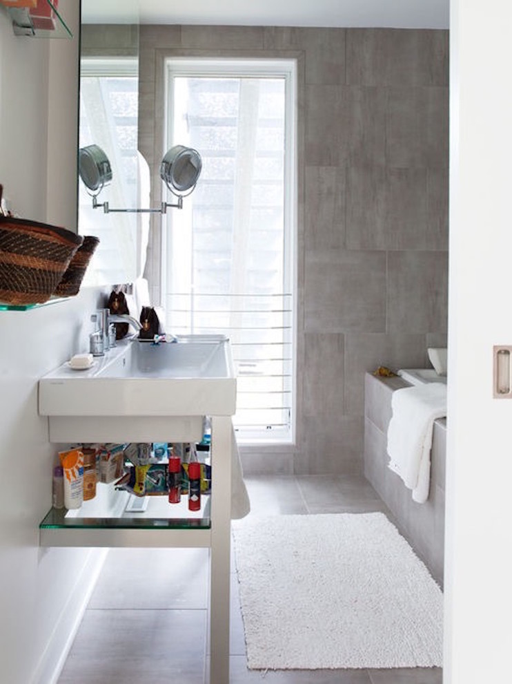 Inspiration for a mid-sized transitional master gray tile and porcelain tile porcelain tile and gray floor alcove bathtub remodel in Chicago with furniture-like cabinets, white cabinets, a one-piece toilet, white walls, an integrated sink and solid surface countertops