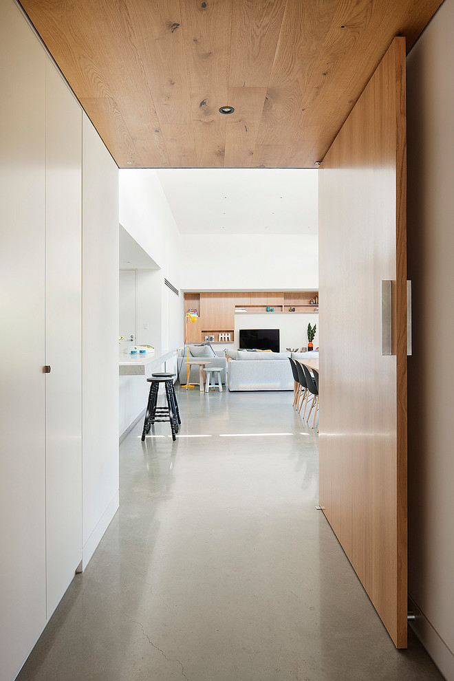 Contemporary hallway in Melbourne with concrete floors and grey floor.