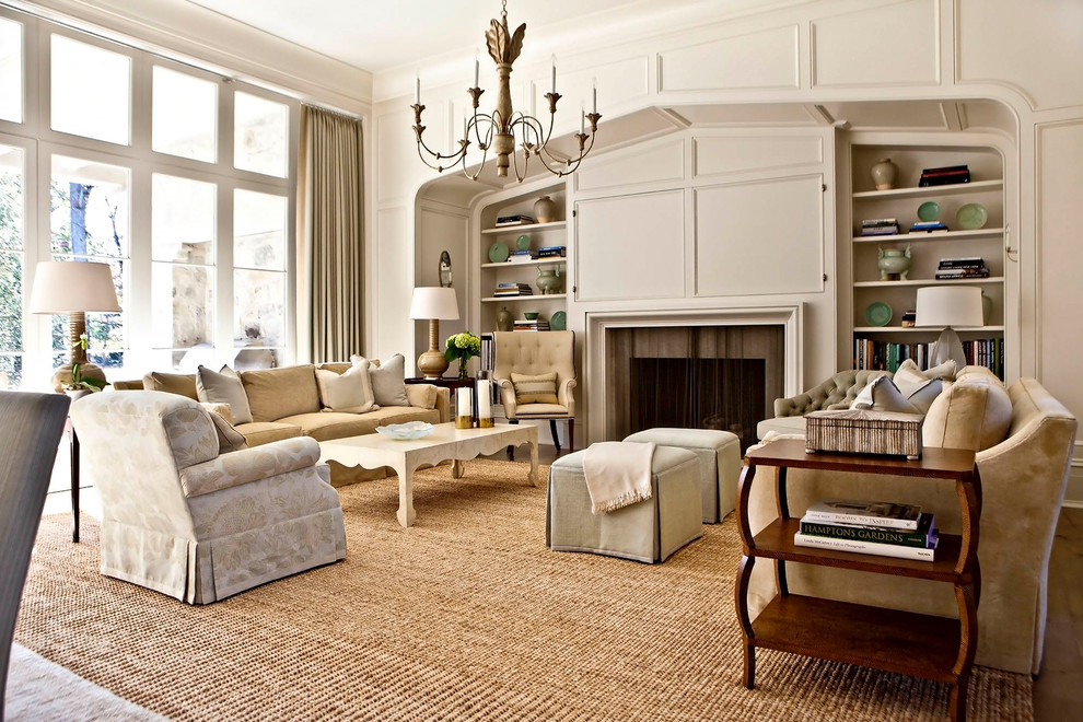 Design ideas for a mid-sized transitional formal open concept living room in Charlotte with white walls, carpet, a standard fireplace, a wood fireplace surround, a concealed tv and beige floor.