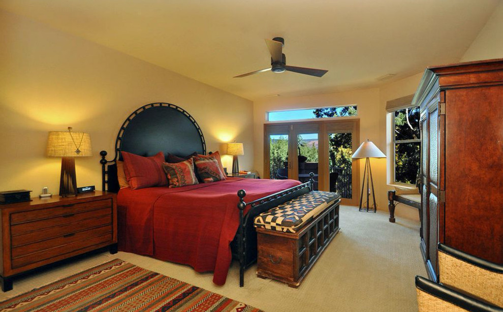 Inspiration for a large master bedroom in Phoenix with beige walls, carpet, no fireplace and beige floor.