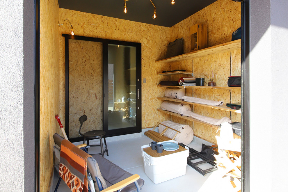 Idée de décoration pour un garage attenant urbain avec un bureau, studio ou atelier.