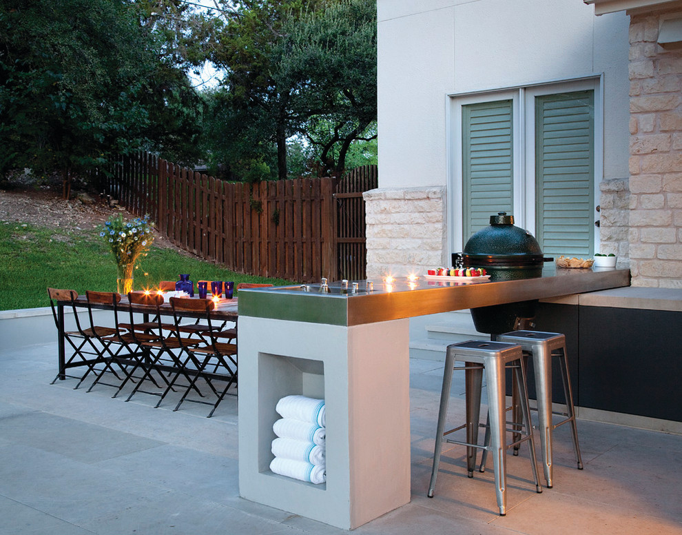 Photo of a mid-sized contemporary backyard patio in Austin with concrete pavers and no cover.