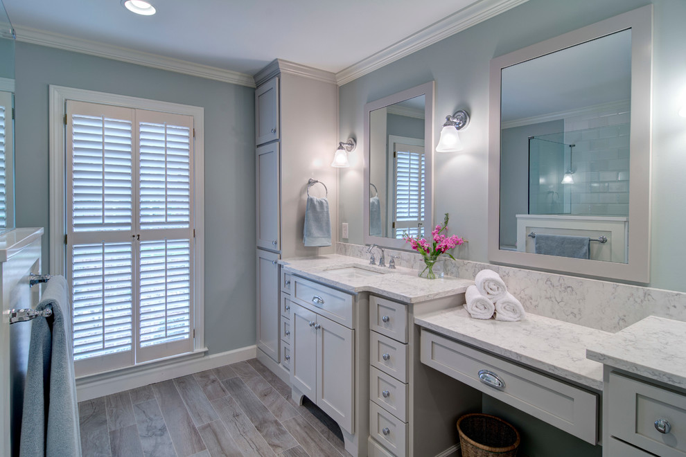 Design ideas for a traditional master bathroom in Atlanta with recessed-panel cabinets, grey cabinets, an open shower, a two-piece toilet, white tile, subway tile, blue walls, porcelain floors, an undermount sink and quartzite benchtops.