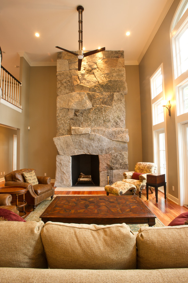 Photo of a transitional living room in Portland Maine with beige walls.