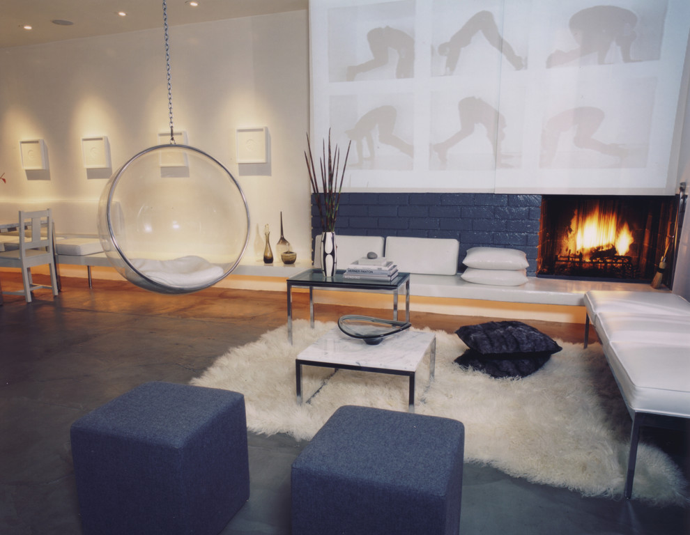 Photo of a contemporary open concept living room in Los Angeles with white walls.