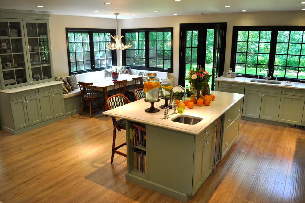 Design ideas for a traditional kitchen in New York with glass-front cabinets.