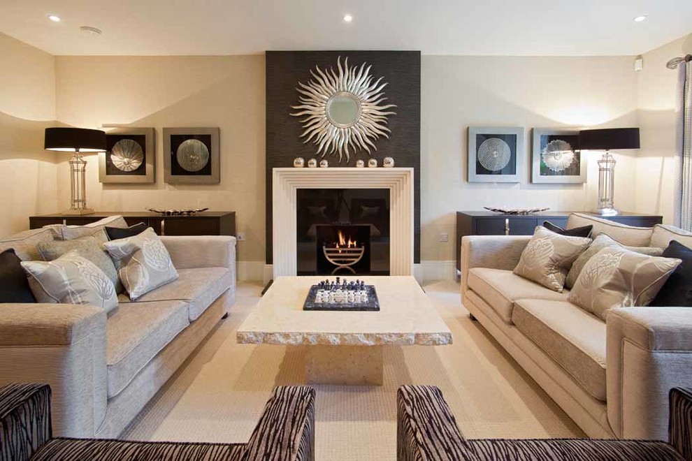 Photo of a large contemporary living room in London with beige walls and a standard fireplace.