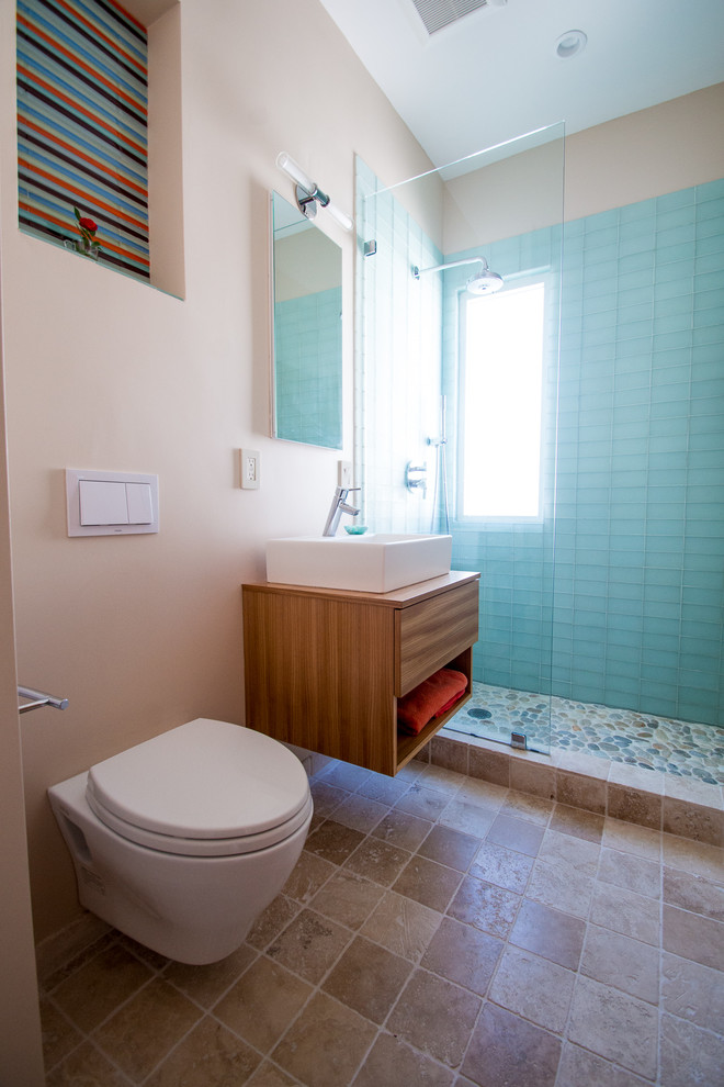 This is an example of a contemporary bathroom in Boston with a wall-mount toilet.