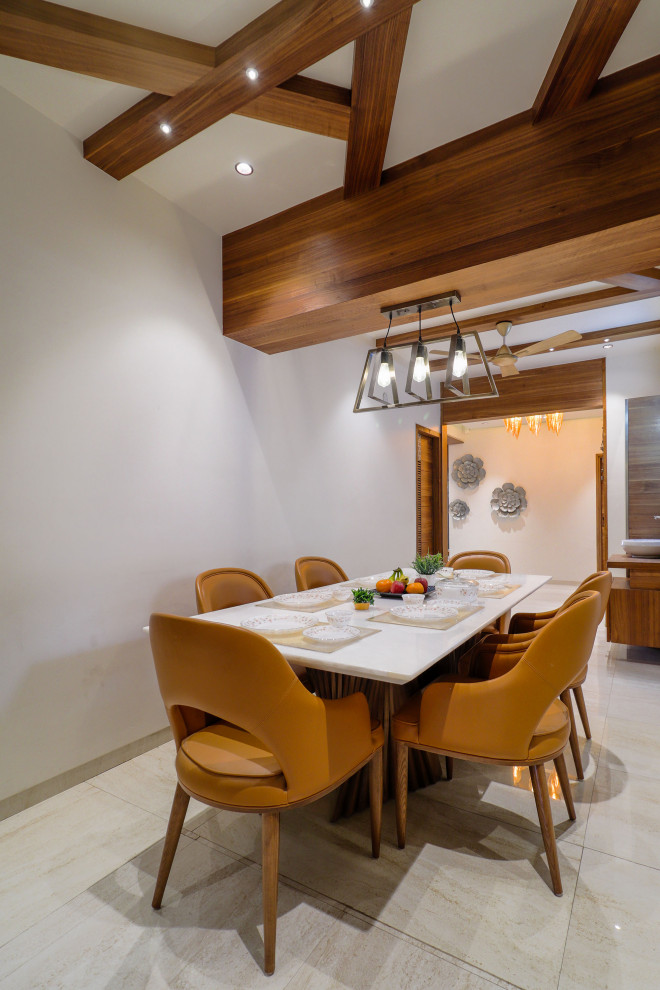 Design ideas for a modern dining room in Ahmedabad.