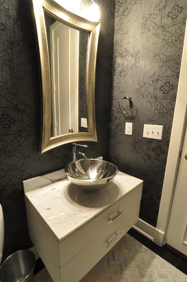 Transitional powder room in Dallas with a vessel sink and flat-panel cabinets.