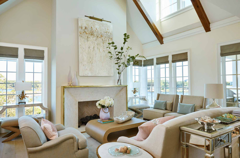 Mid-sized beach style living room in New York with beige walls, a standard fireplace and a concrete fireplace surround.