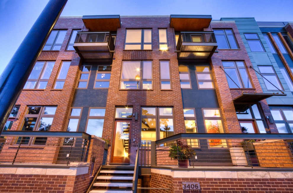 Photo of a transitional three-storey exterior in Denver.