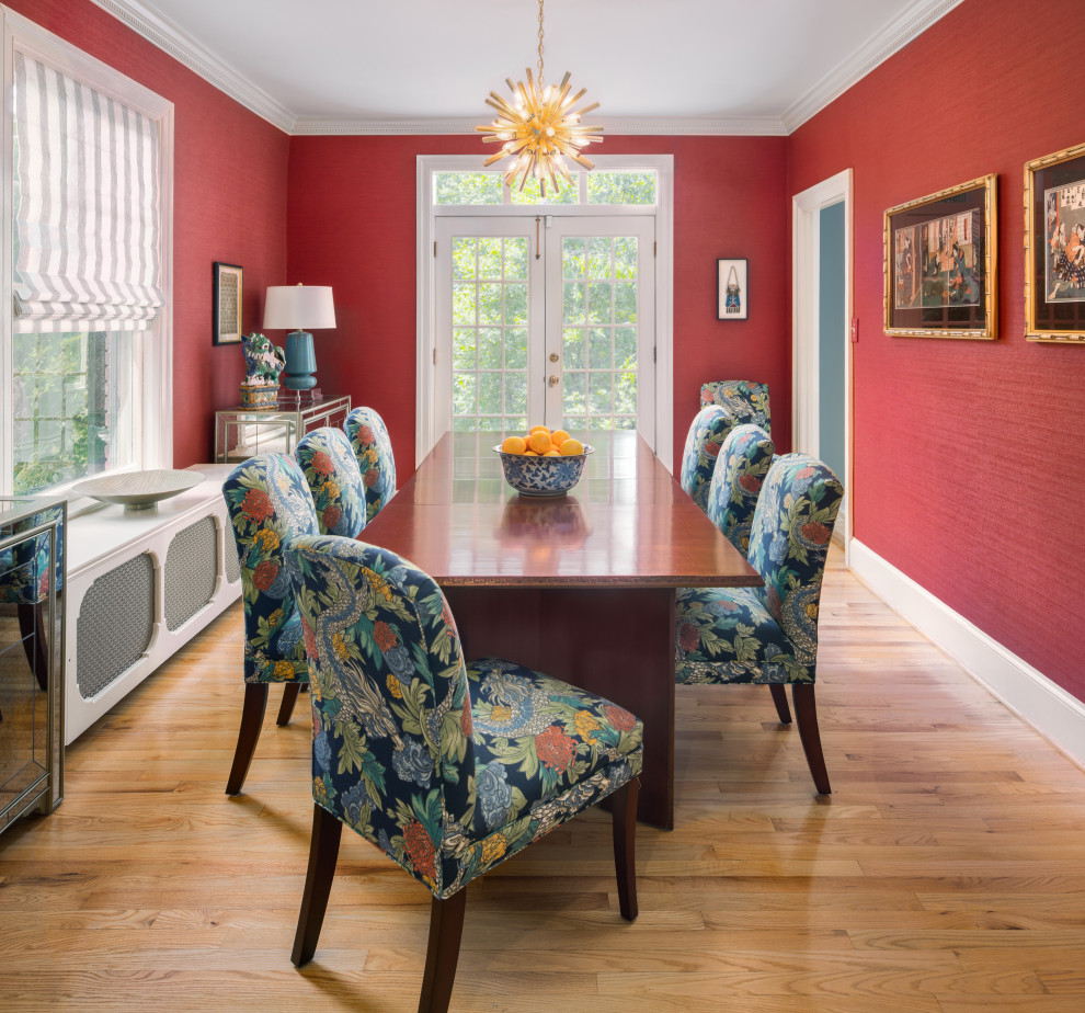 Inspiration for a traditional separate dining room in DC Metro with red walls, light hardwood floors and no fireplace.