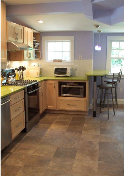 Small arts and crafts galley ceramic tile eat-in kitchen photo in Boston with an undermount sink, shaker cabinets, light wood cabinets, solid surface countertops, metallic backsplash, metal backsplash, stainless steel appliances and a peninsula