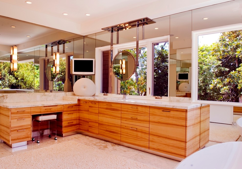 Large contemporary master bathroom in Orange County with flat-panel cabinets, medium wood cabinets, a freestanding tub, multi-coloured walls, marble floors and marble benchtops.