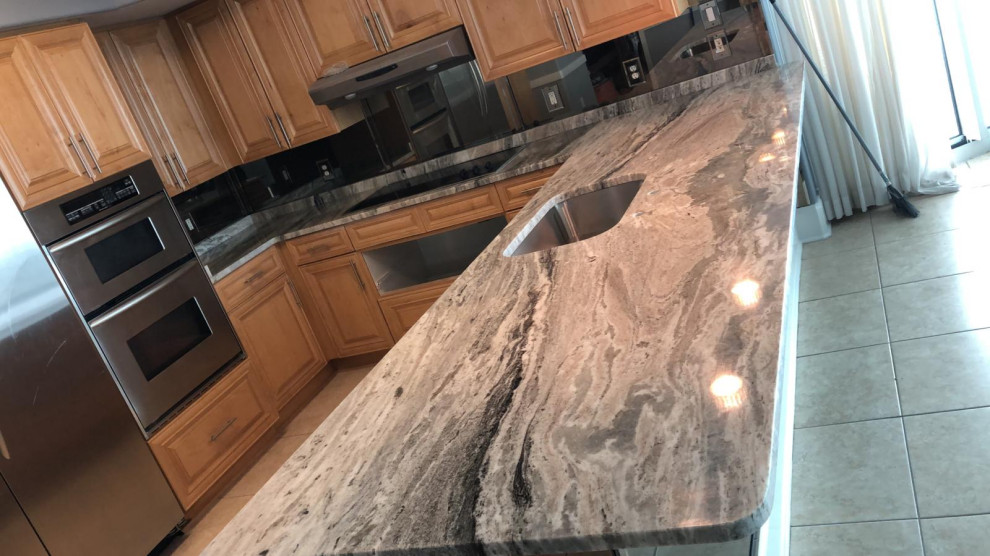 Kitchen - kitchen idea with granite countertops and multicolored countertops
