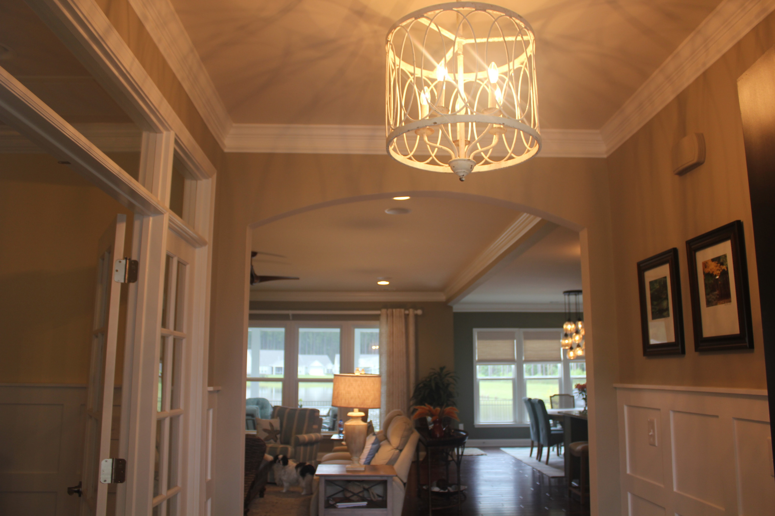 Entry foyer with custom wainscoting and crown molding