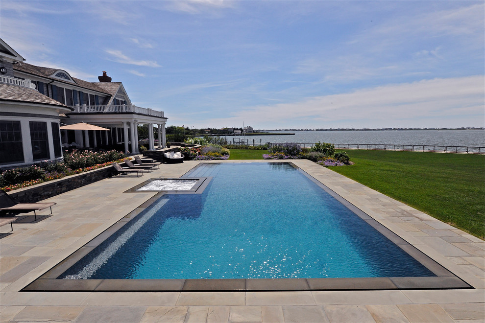 Inspiration for a beach style rectangular infinity pool in New York.