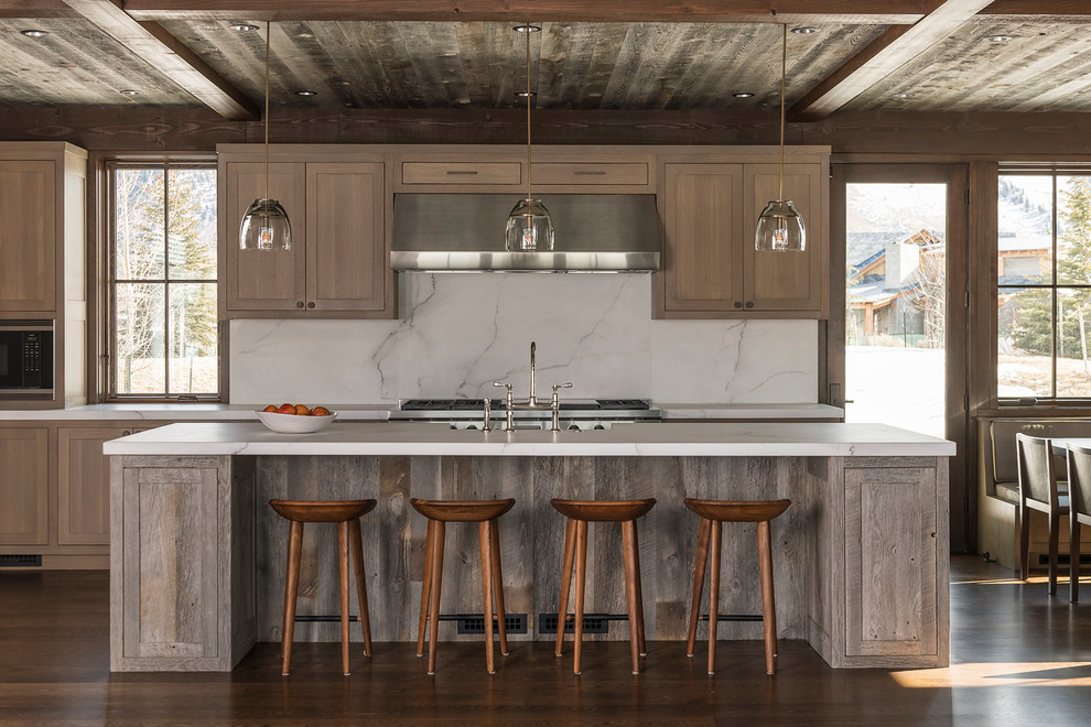 Design ideas for a country galley eat-in kitchen in Other with shaker cabinets, medium wood cabinets, white splashback, stainless steel appliances, dark hardwood floors, with island, brown floor and white benchtop.
