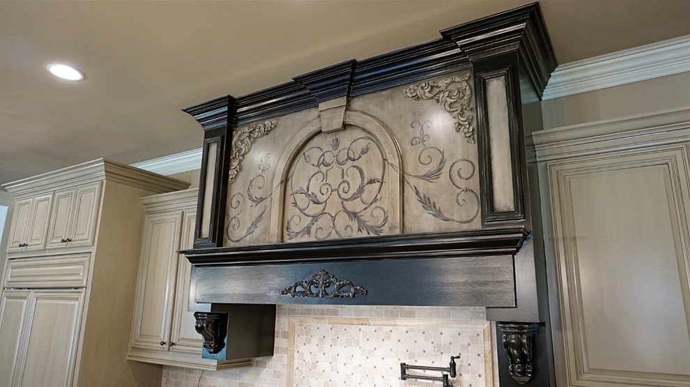This is an example of an expansive traditional u-shaped eat-in kitchen in Atlanta with an undermount sink, raised-panel cabinets, distressed cabinets, granite benchtops, beige splashback, subway tile splashback, stainless steel appliances, dark hardwood floors and multiple islands.
