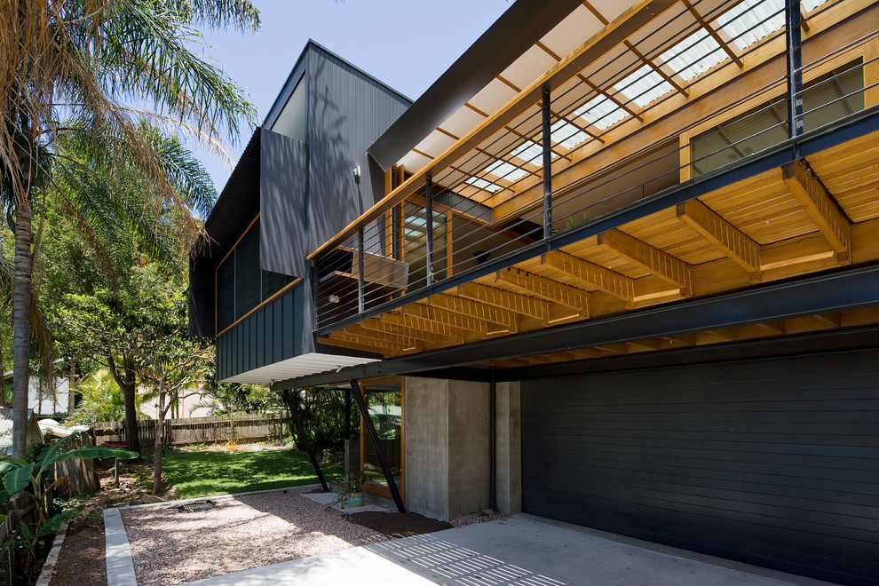This is an example of a contemporary attached two-car garage in Sydney.