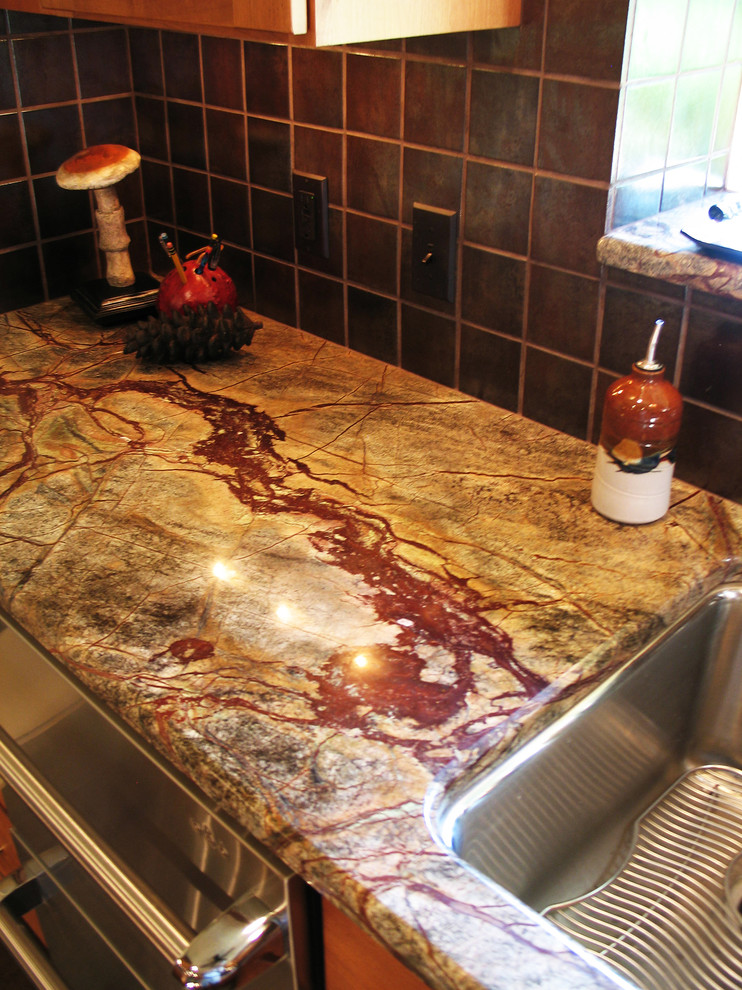 Example of a large transitional u-shaped eat-in kitchen design in New Orleans with a double-bowl sink, medium tone wood cabinets, marble countertops, brown backsplash, ceramic backsplash, stainless steel appliances and no island