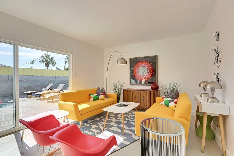 Mid-sized midcentury open concept living room in Phoenix with white walls and concrete floors.