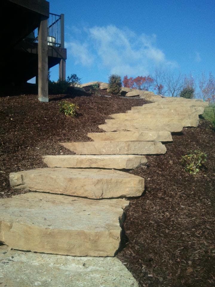 This is an example of a mid-sized side yard stone garden path.