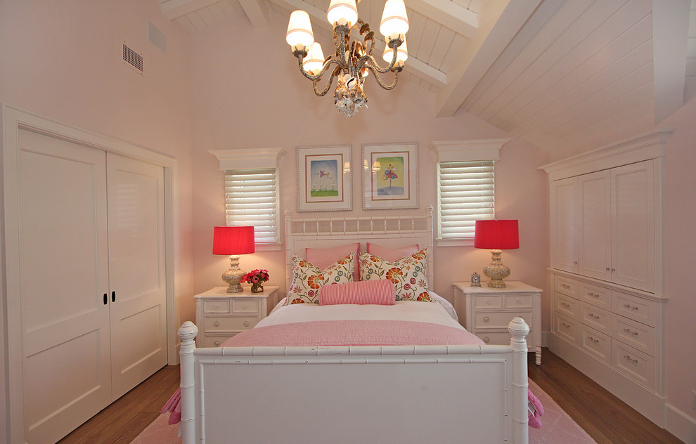 Traditional kids' room in Orange County with pink walls for girls.
