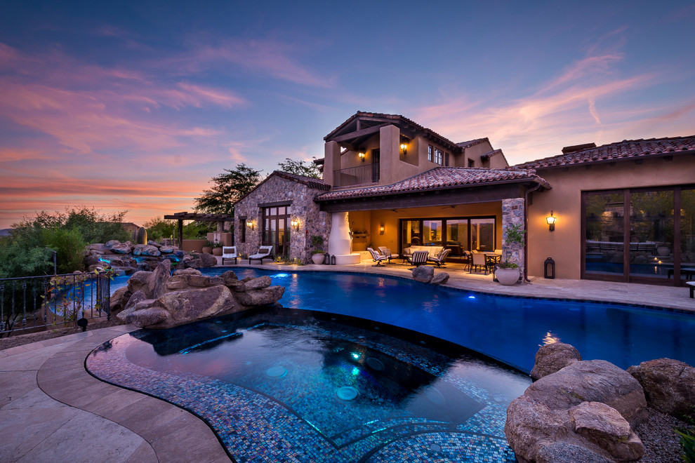 Inspiration for a rustic pool remodel in Phoenix