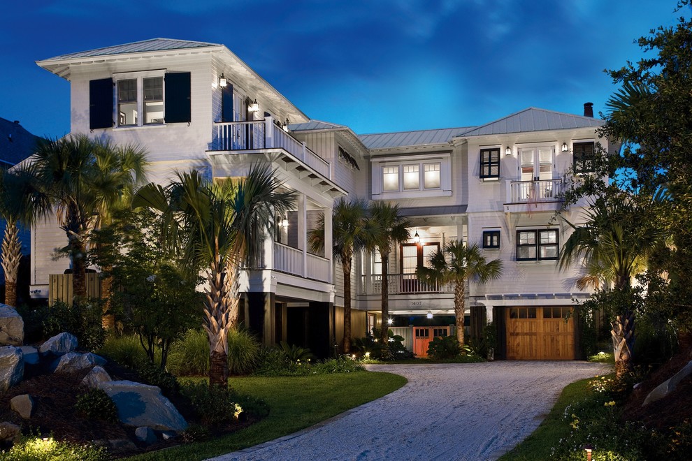 Design ideas for a beach style three-storey exterior in Charleston.