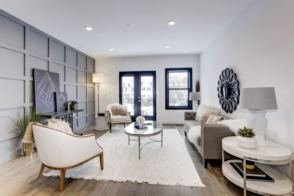 Transitional formal and open concept medium tone wood floor and brown floor living room photo in DC Metro with white walls, no fireplace and no tv