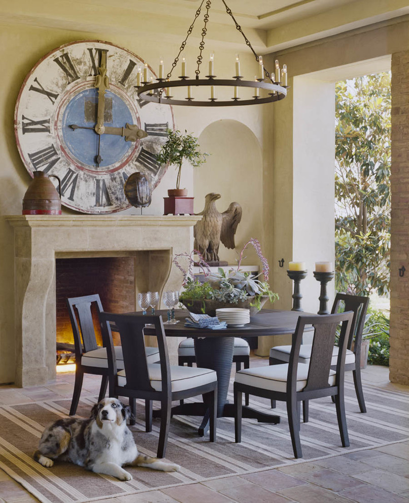 Design ideas for a mid-sized mediterranean separate dining room in Orange County with beige walls, slate floors and multi-coloured floor.
