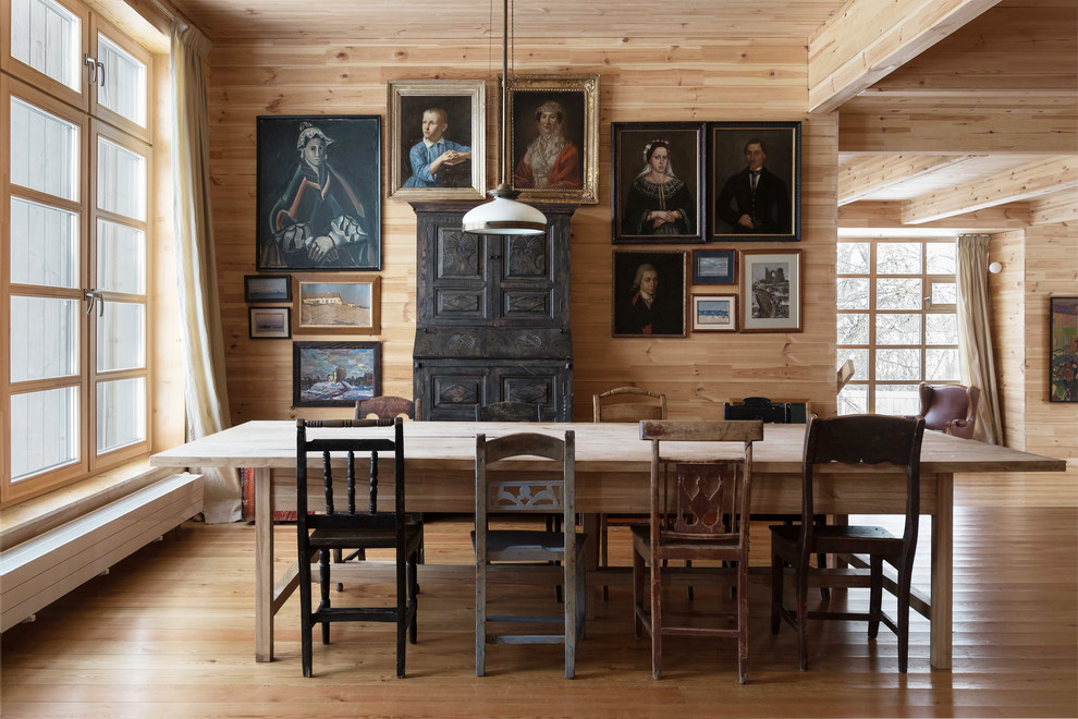 Inspiration for a large country open plan dining in Moscow with light hardwood floors and no fireplace.