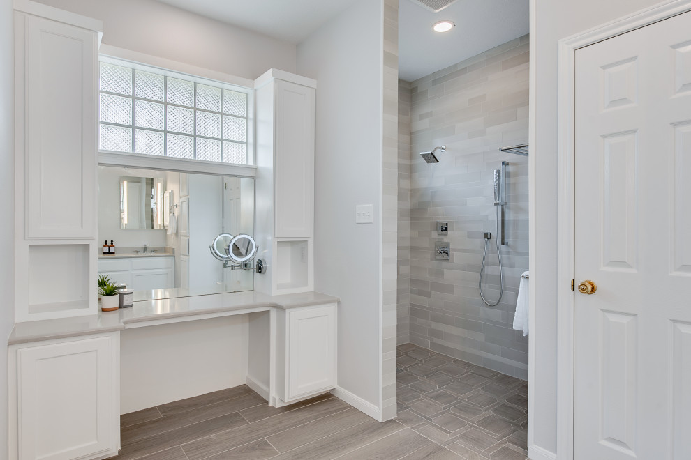 Large modern master bathroom in Austin with recessed-panel cabinets, white cabinets, a double shower, gray tile, mosaic tile, white walls, wood-look tile, an undermount sink, engineered quartz benchtops, grey floor, an open shower, grey benchtops, a double vanity and a built-in vanity.