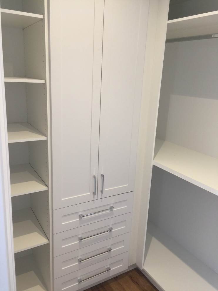 Example of a transitional closet design in Toronto