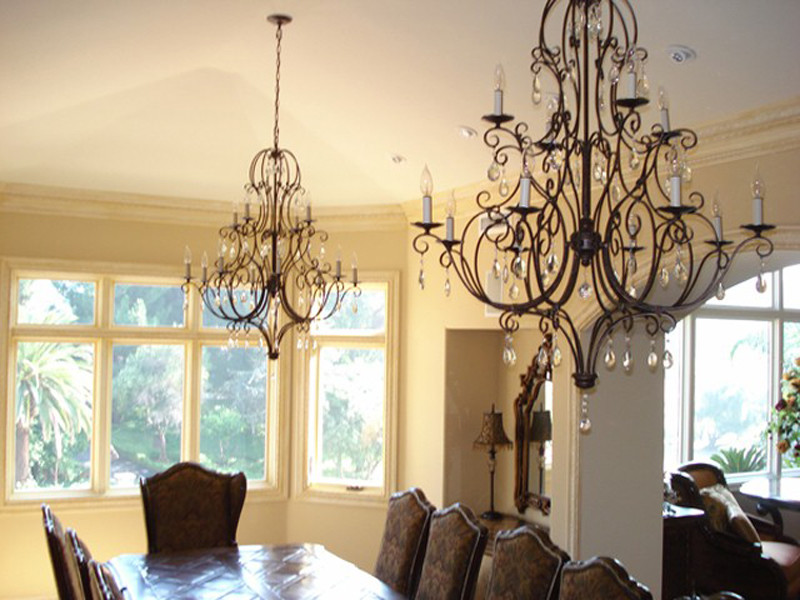 Inspiration for a large mediterranean separate dining room in Los Angeles with yellow walls, no fireplace and coffered.