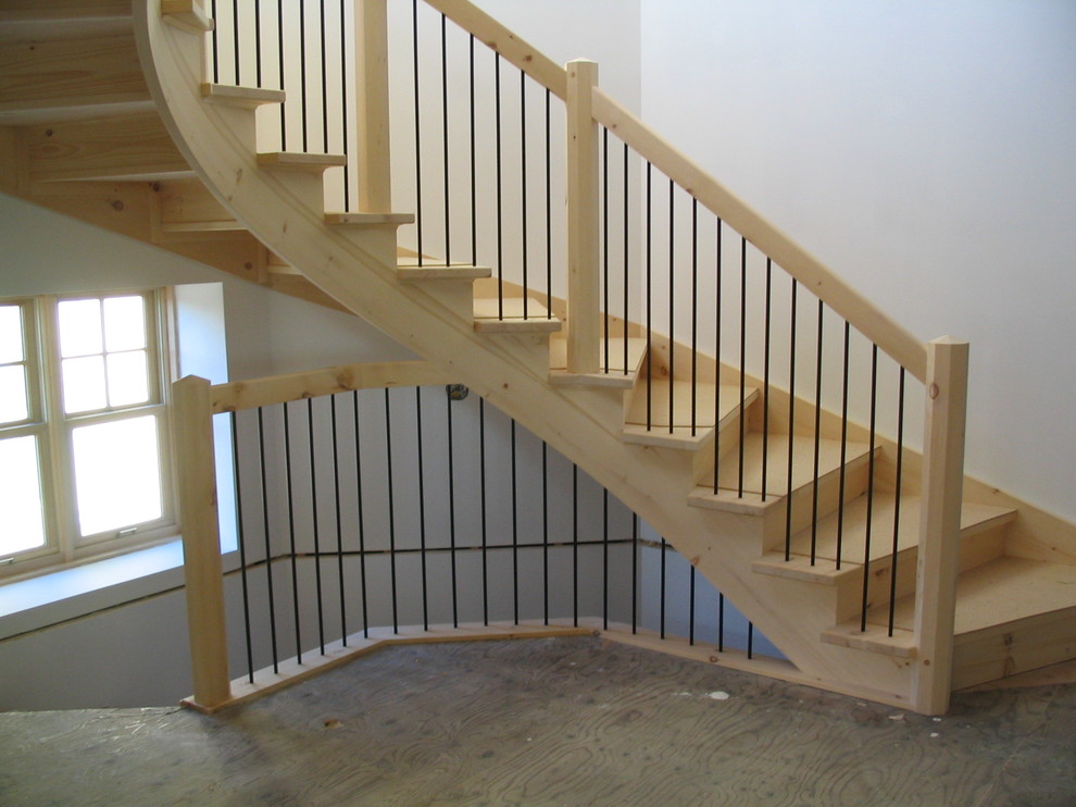 Staircase - huge rustic wooden curved staircase idea with wooden risers