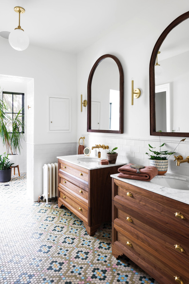 Design ideas for a mid-sized transitional master bathroom in DC Metro with medium wood cabinets, white tile, subway tile, white walls, an undermount sink, multi-coloured floor, white benchtops, a double vanity, a freestanding vanity and recessed-panel cabinets.
