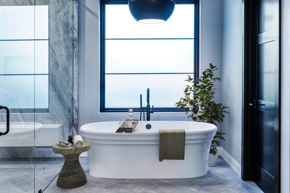 Freestanding Soaking Tub & Black Framed Window Primary Bathroom | French Country