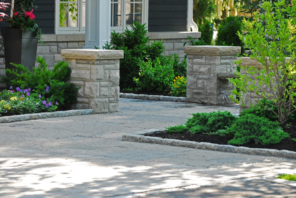 Photo of a large rustic full sun front yard stone formal garden in Toronto for summer.