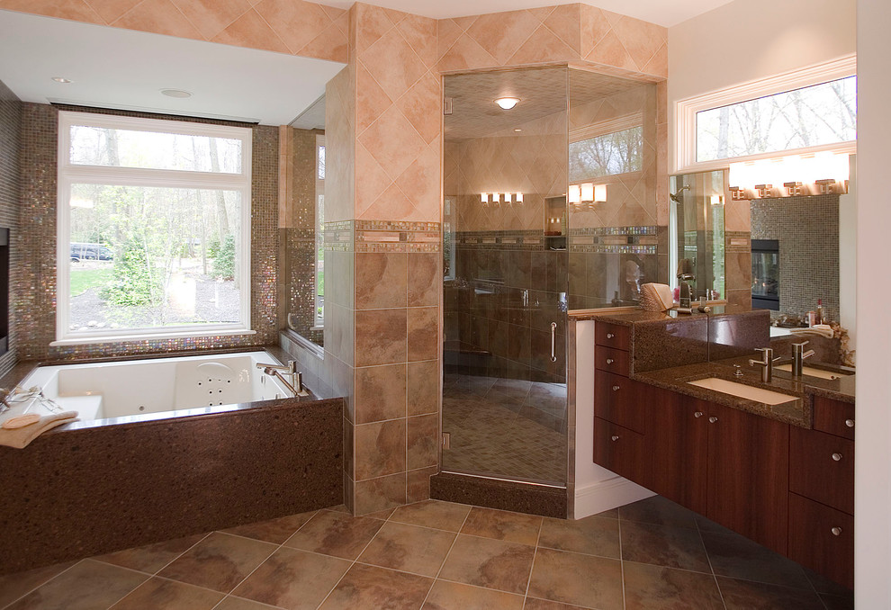 This is an example of a large contemporary master bathroom in Other with an undermount sink, flat-panel cabinets, dark wood cabinets, engineered quartz benchtops, a drop-in tub, a corner shower, glass tile, slate floors, a two-piece toilet, beige walls, a hinged shower door and multi-coloured tile.