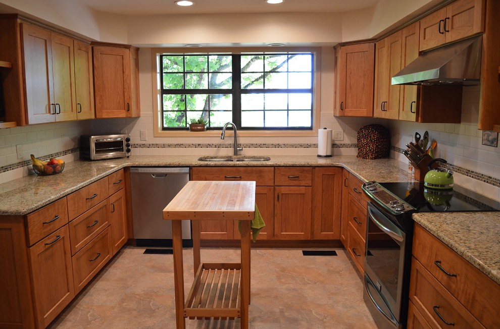 Kitchen - mid-sized u-shaped kitchen idea with granite countertops