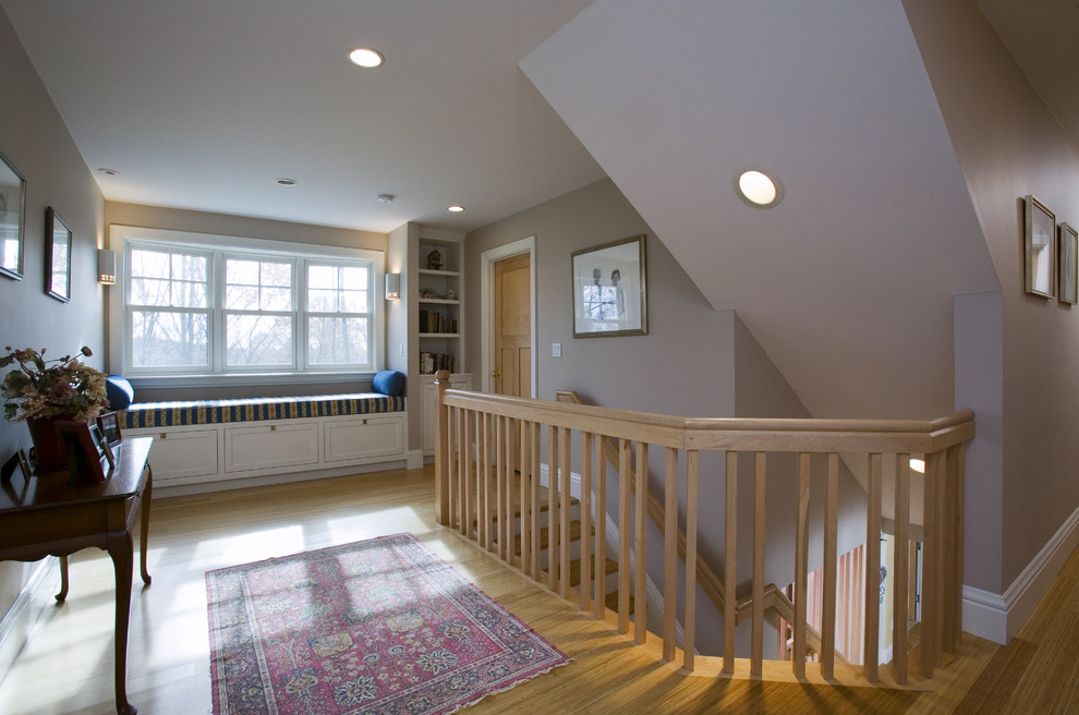 Photo of a traditional wood staircase in Boston with wood railing.