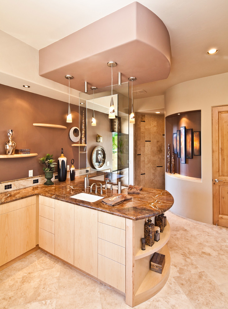 Photo of a large traditional master bathroom in Phoenix with marble benchtops, an undermount sink, flat-panel cabinets, light wood cabinets, an open shower, beige tile, stone tile, beige walls and travertine floors.