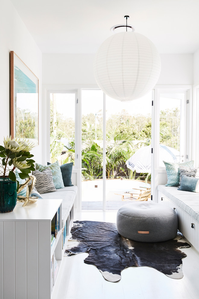 Photo of a small contemporary sunroom in Sydney with painted wood floors, a standard ceiling and white floor.