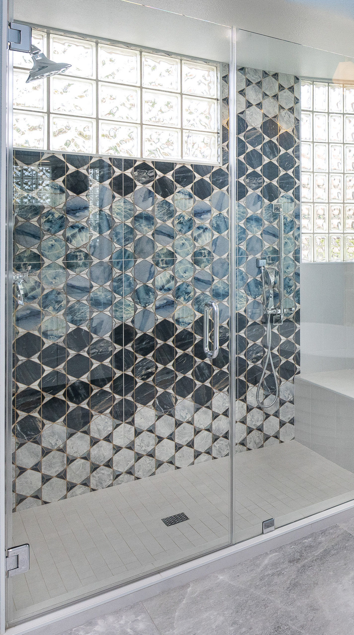 Primary bathroom hexagon tile with gold inlay detail