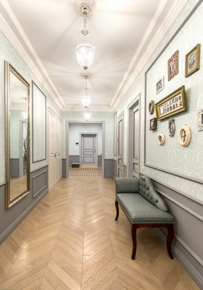 Inspiration for a mid-sized traditional hallway in Moscow with blue walls, ceramic floors and beige floor.
