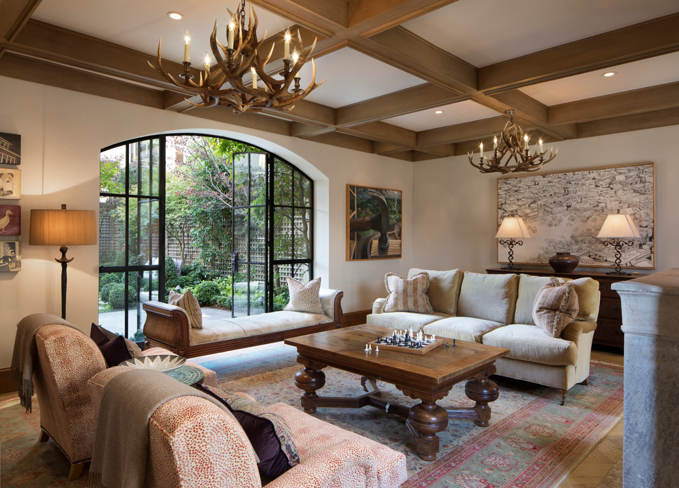 Inspiration for a traditional living room in Los Angeles with beige walls, dark hardwood floors and no tv.