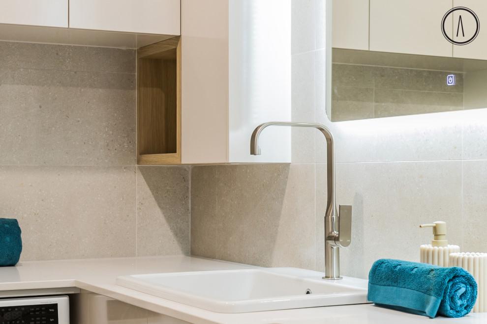 This is an example of a beach style laundry room in Perth.